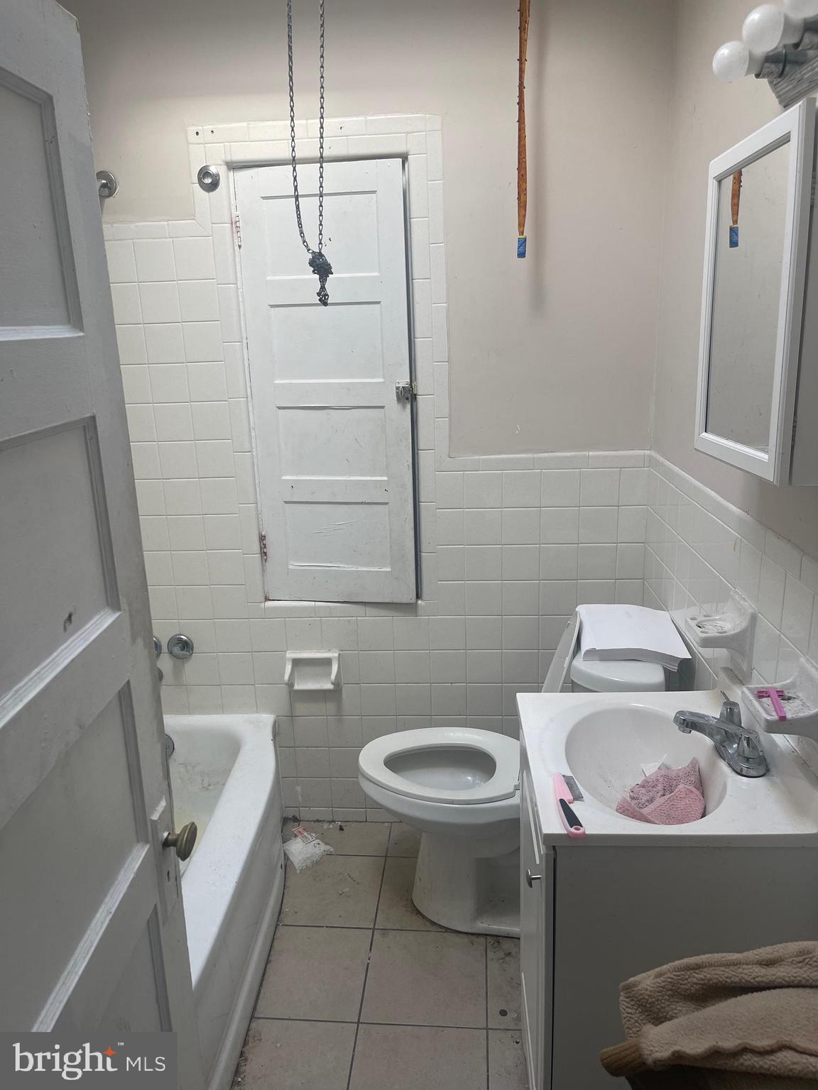 124 North 3rd Street Darby, PA 19023 - Photo 11 of 16 a bathroom with a sink a toilet and shower