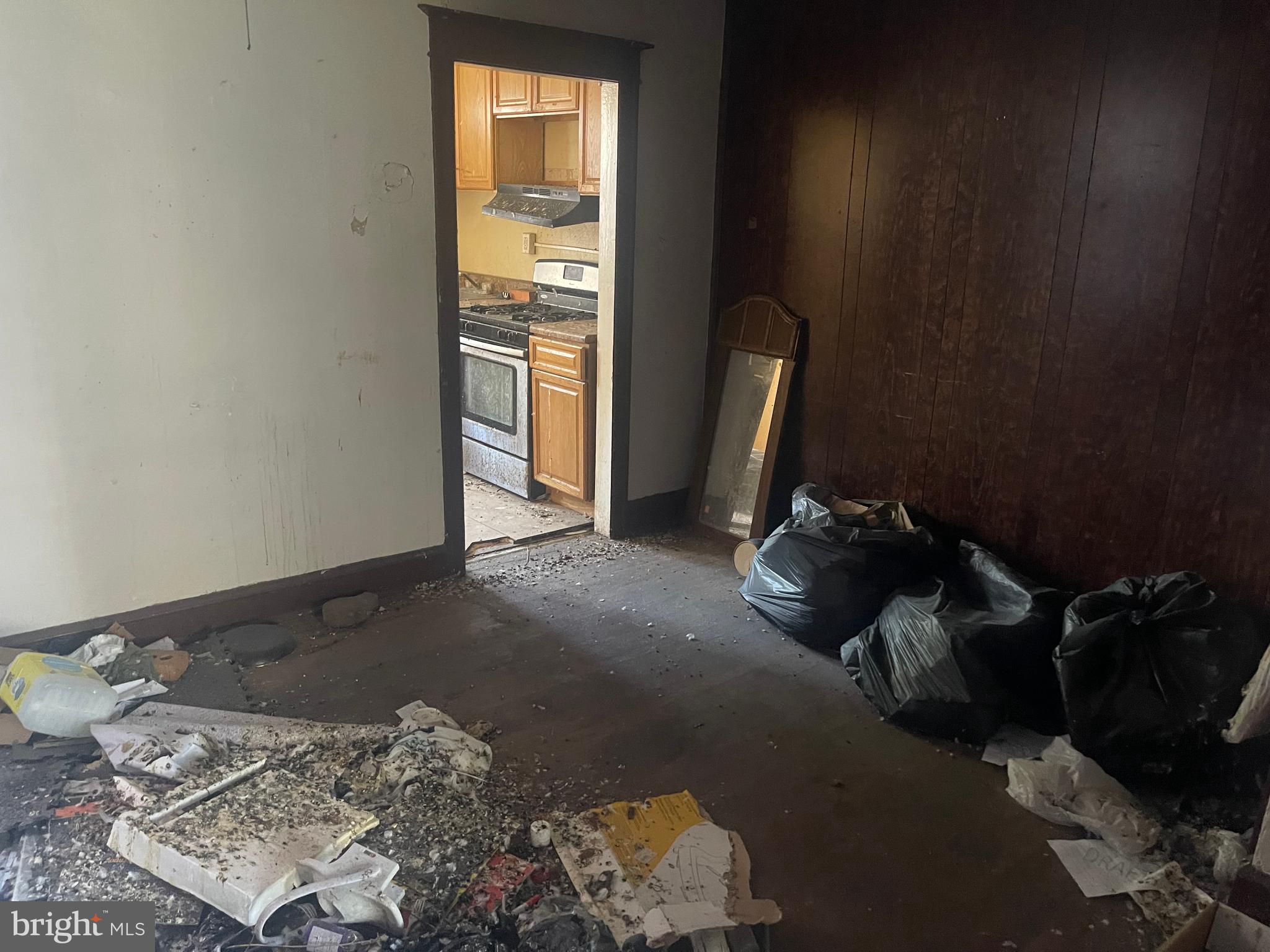 124 North 3rd Street Darby, PA 19023 - Photo 5 of 16 a bed sitting in a room next to a window