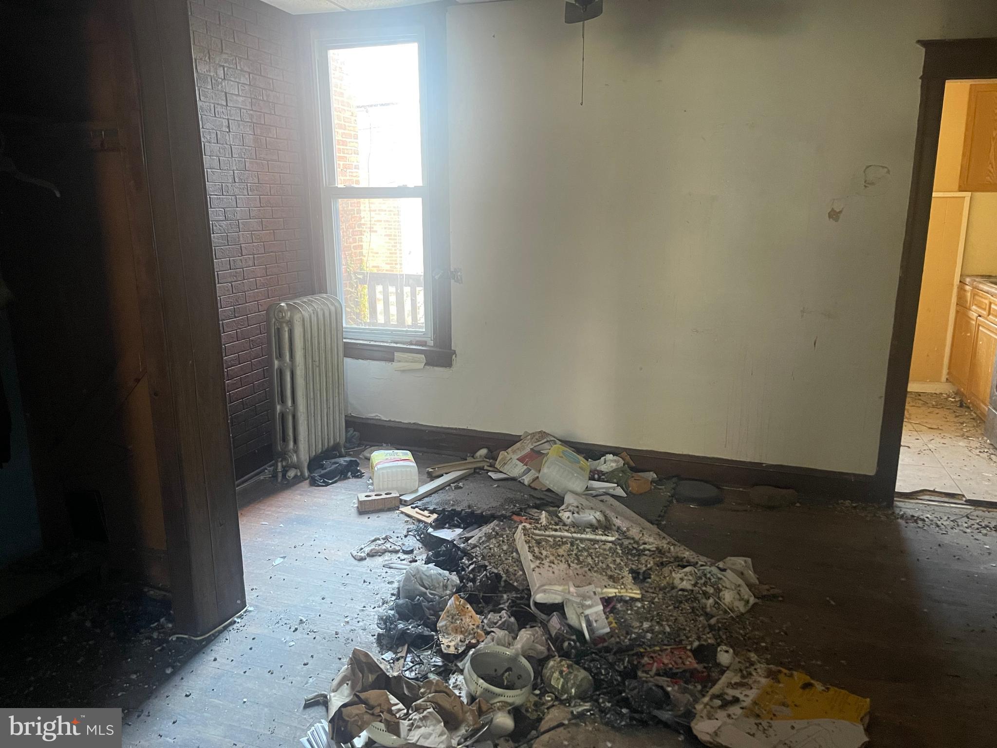 124 North 3rd Street Darby, PA 19023 - Photo 6 of 16 a bedroom with a bed and a window