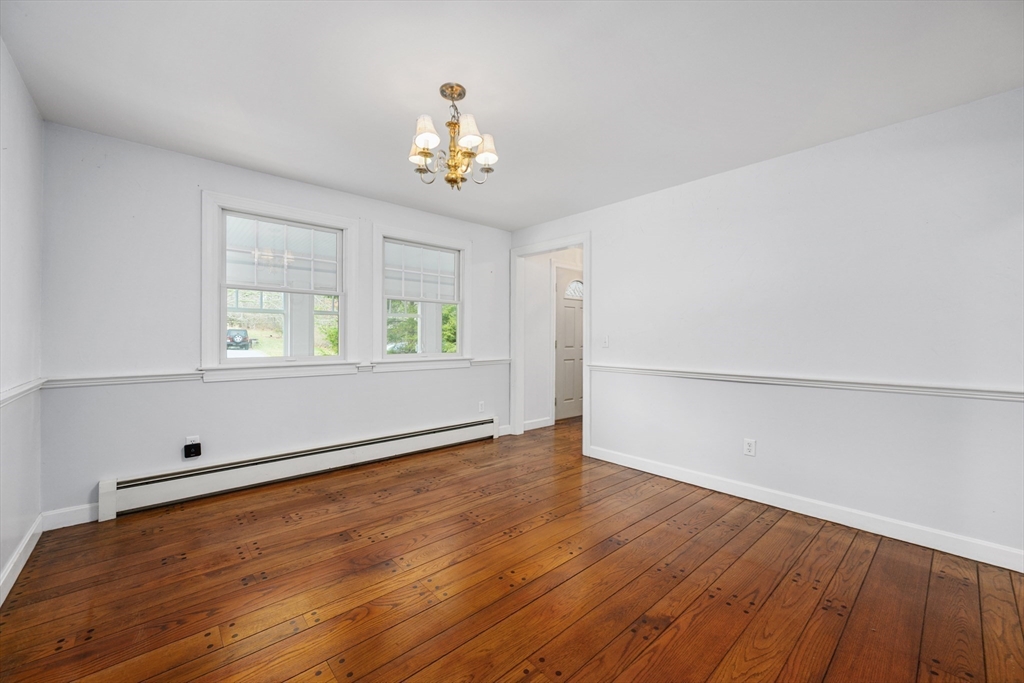 25 Robert Road Harwich, MA 02645 - Photo 11 of 36 an empty room with wooden floor and windows