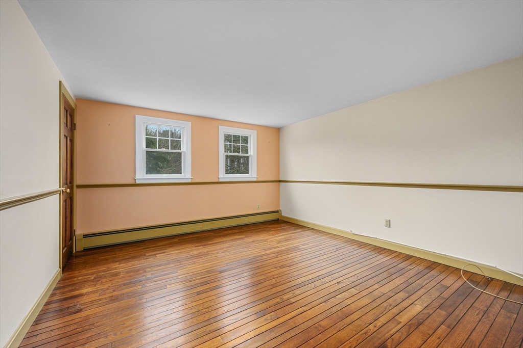 25 Robert Road Harwich, MA 02645 - Photo 22 of 36 a view of a room with wooden floor and white walls