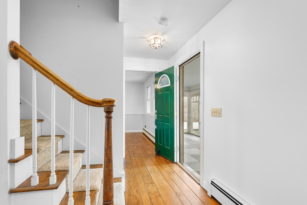 25 Robert Road Harwich, MA 02645 - Photo 4 of 36 a view of a balcony with wooden floor and staircase