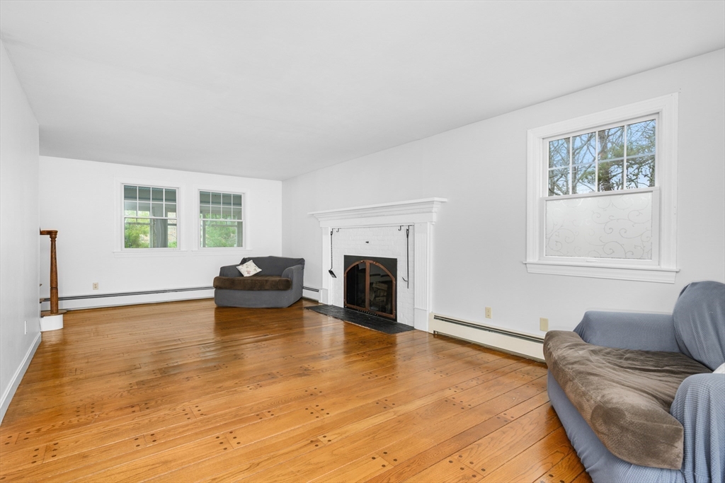 25 Robert Road Harwich, MA 02645 - Photo 6 of 36 a living room with furniture and a fireplace