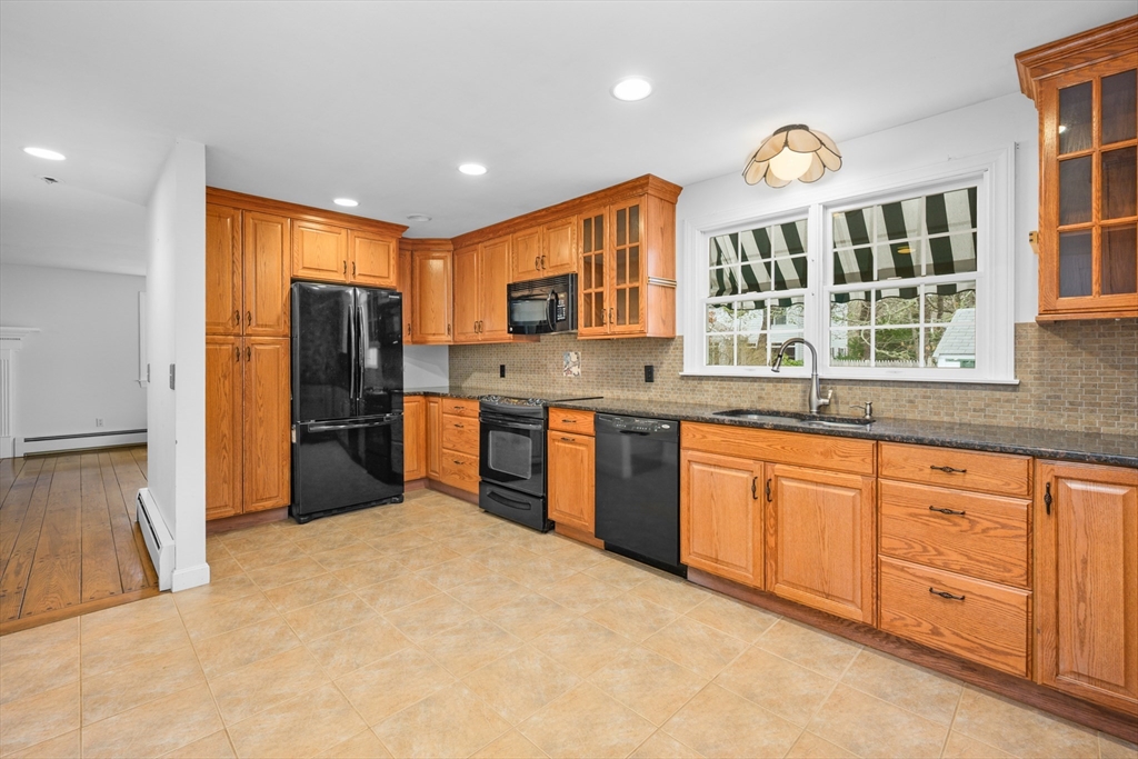 25 Robert Road Harwich, MA 02645 - Photo 10 of 36 a kitchen with stainless steel appliances granite countertop a refrigerator and a sink
