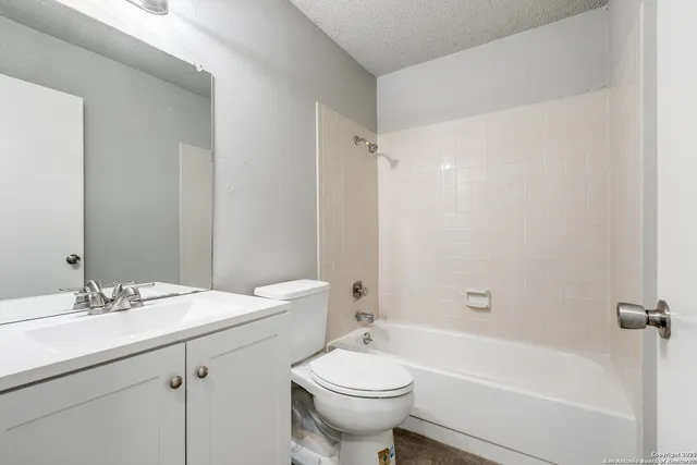 a bathroom with a sink a toilet and a bathtub