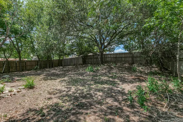 a backyard of a house with lots of green space