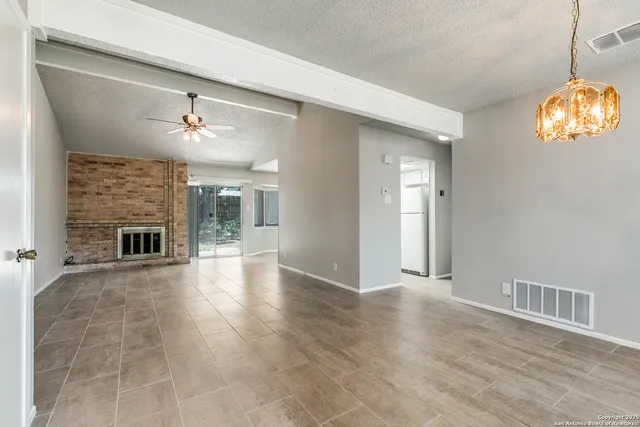 a view of livingroom with furniture wooden floor and a fireplace