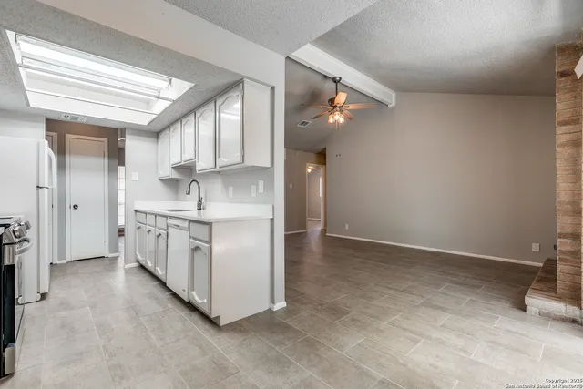 a view of kitchen with sink and cabinet