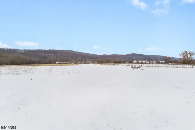 a view of lake with mountain in the background