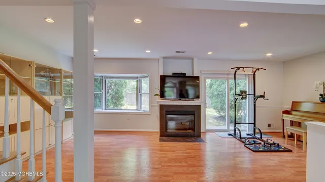 a view of a livingroom with a fireplace and workspace