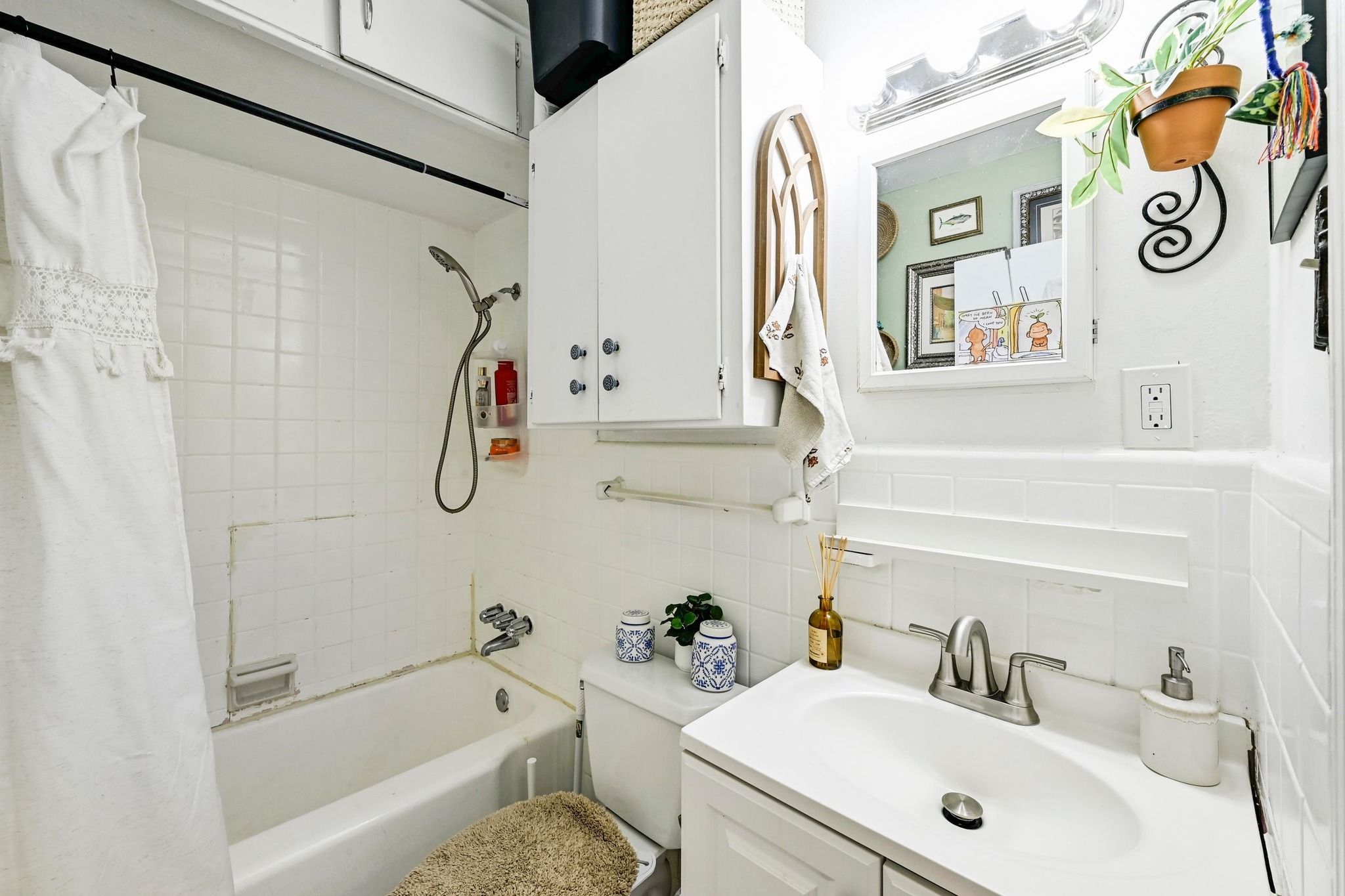 4530 Avenue D, Unit B Austin, TX 78751 - Photo 20 of 29 a bathroom with a sink a mirror and a shower