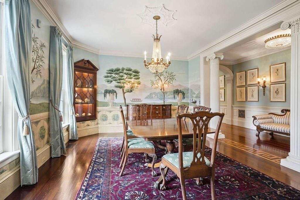 25 Smith Street Dover, MA 02030 - Photo 18 of 39 a dining room with furniture a chandelier and wooden floor
