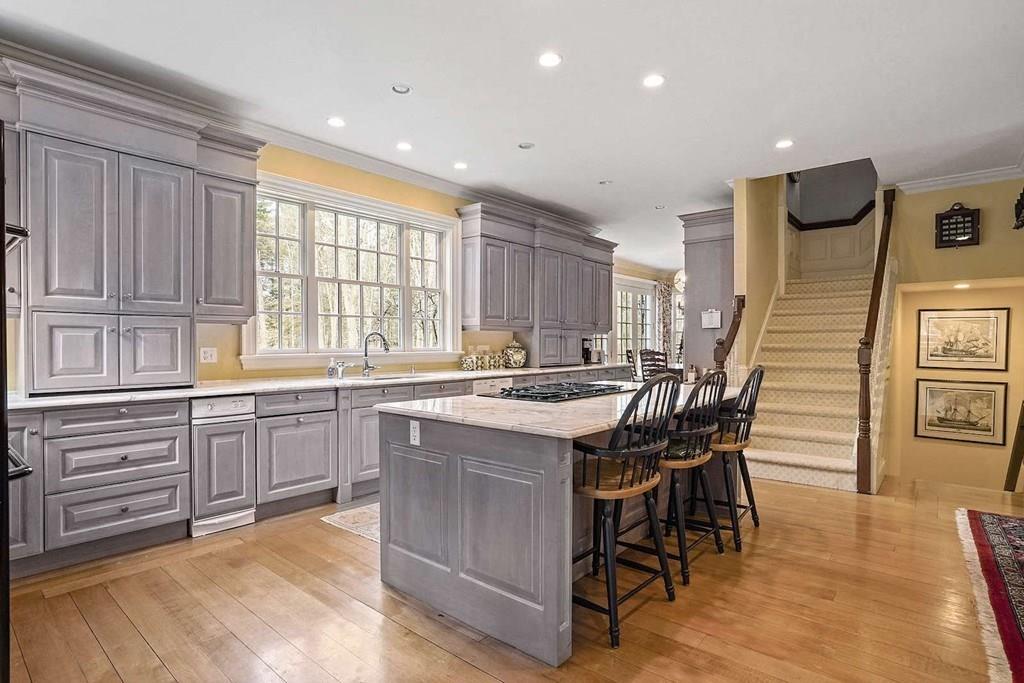25 Smith Street Dover, MA 02030 - Photo 5 of 39 a kitchen with a table chairs sink and cabinets