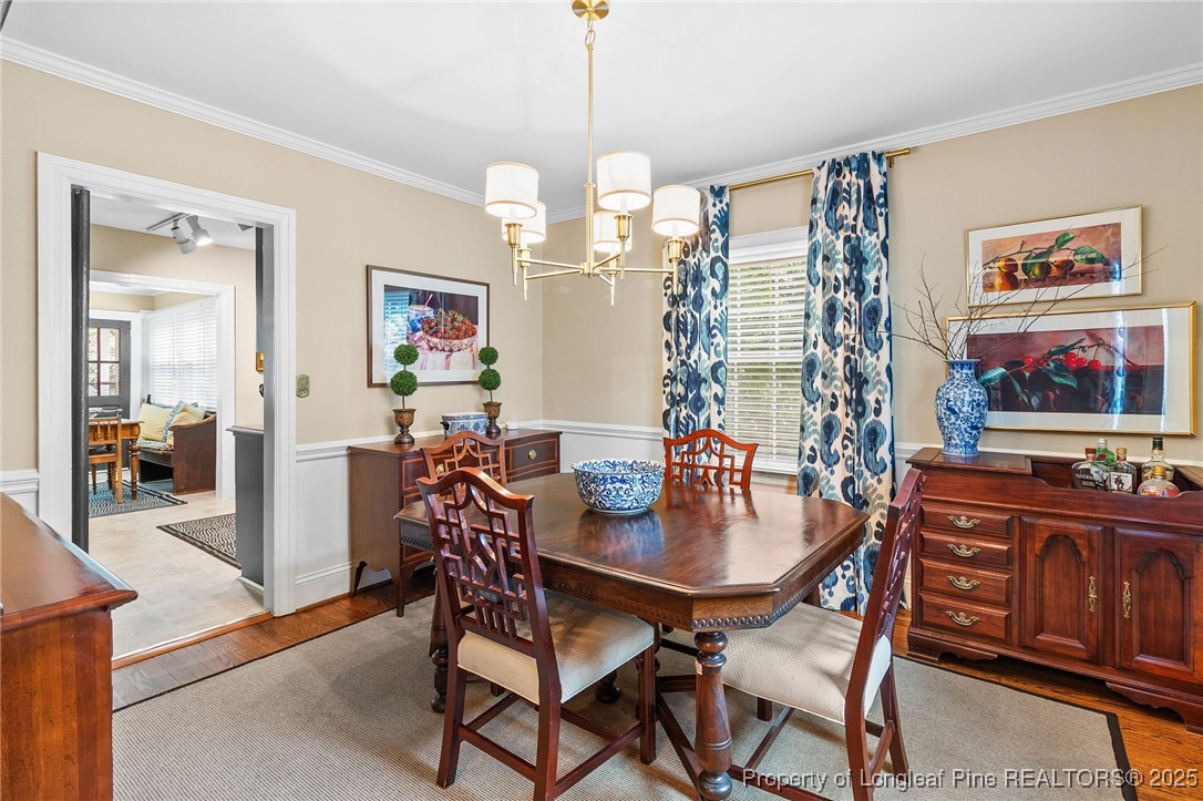 503 Rush Road Fayetteville, NC 28305 - Photo 16 of 50 a view of a dining room with furniture window and wooden floor