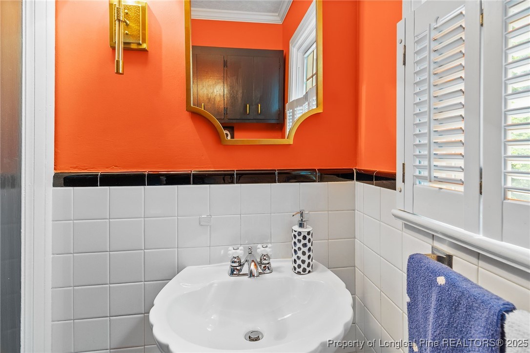 503 Rush Road Fayetteville, NC 28305 - Photo 24 of 50 a bathroom with a sink and a mirror