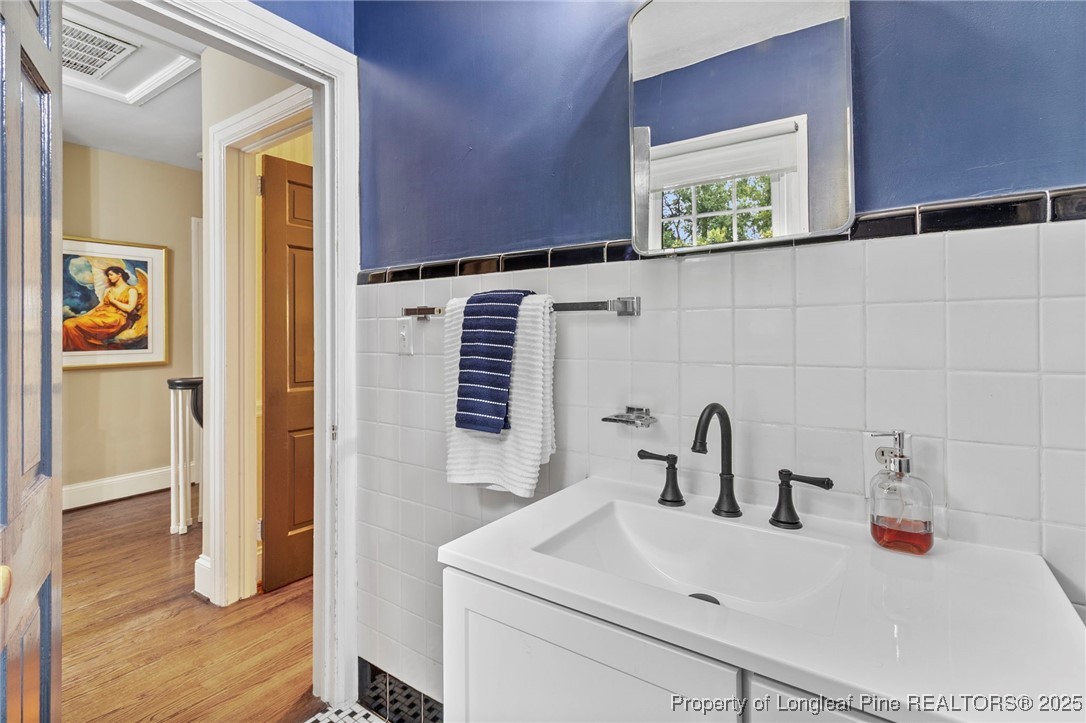 503 Rush Road Fayetteville, NC 28305 - Photo 28 of 50 a bathroom with a sink and a mirror