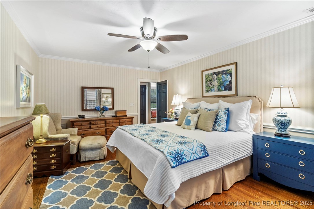 503 Rush Road Fayetteville, NC 28305 - Photo 30 of 50 a bedroom with a bed and wooden floor