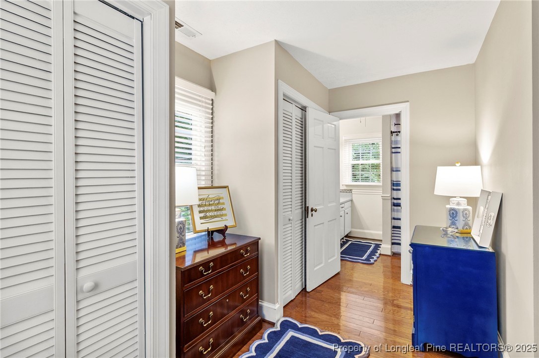 503 Rush Road Fayetteville, NC 28305 - Photo 32 of 50 a bedroom with a bed and wooden floor