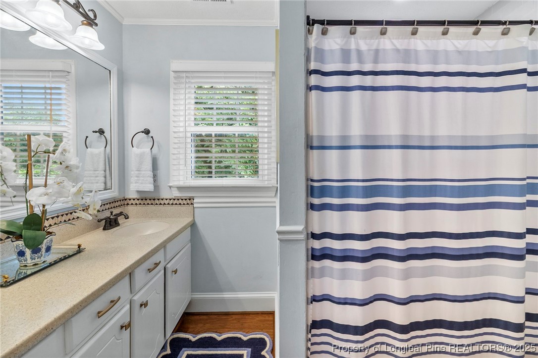 503 Rush Road Fayetteville, NC 28305 - Photo 33 of 50 a bathroom with a sink and a mirror