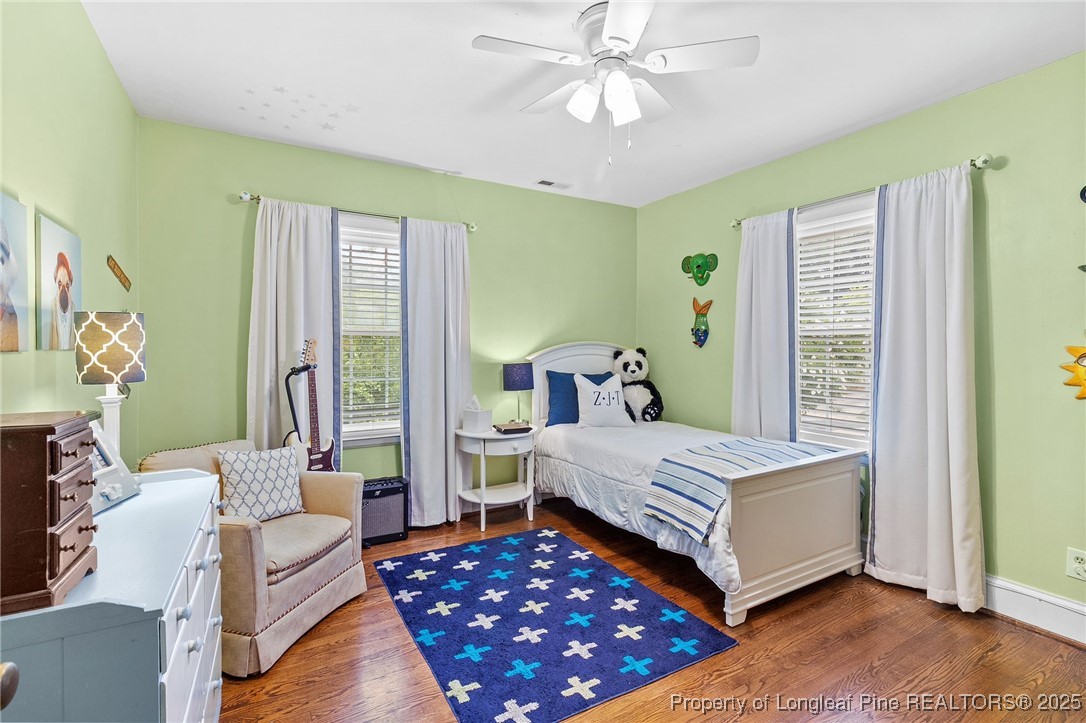 503 Rush Road Fayetteville, NC 28305 - Photo 37 of 50 a bedroom with a bed and a chandelier