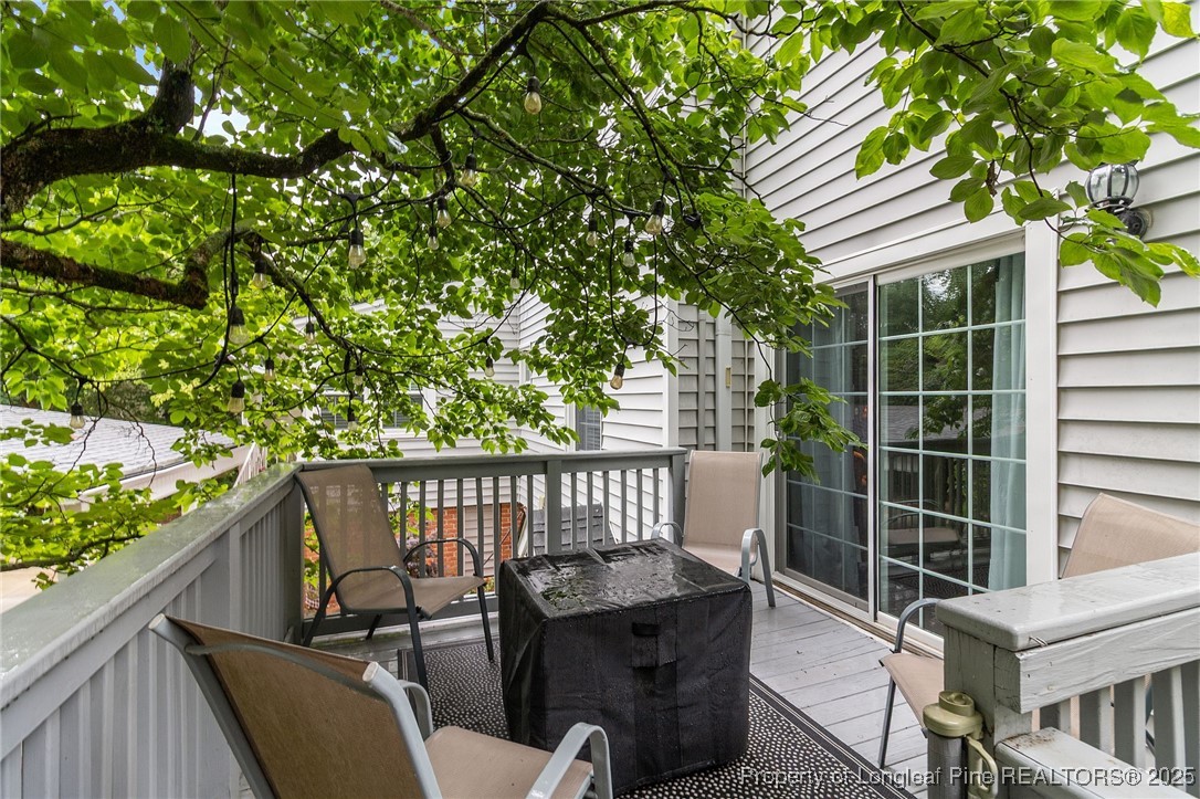 503 Rush Road Fayetteville, NC 28305 - Photo 43 of 50 a view of a balcony with chair and wooden fence