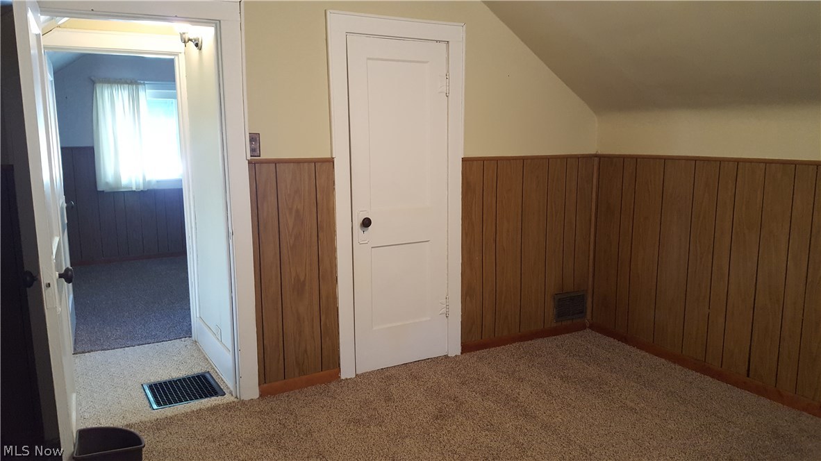 693 Darrow Road Akron, OH 44305 - Photo 27 of 35 Front bed room has the original hard wood floors and a nice, bright vinyl window. The carpet is brand new. Nice size closet.