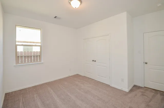 an empty room with windows