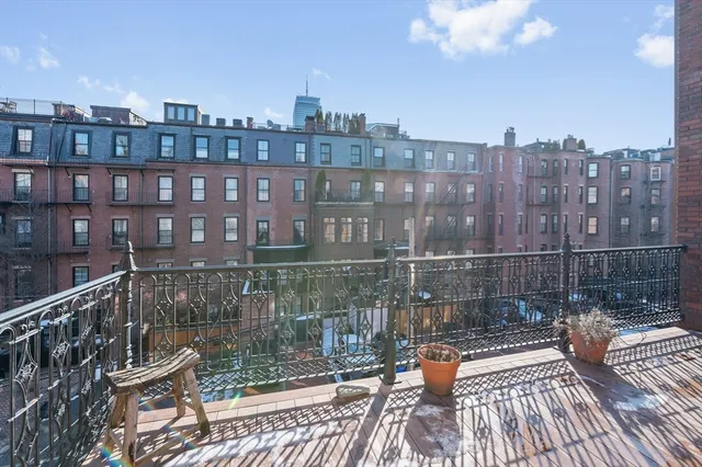 a view of a balcony with city view