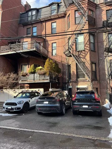 a car parked in front of a building