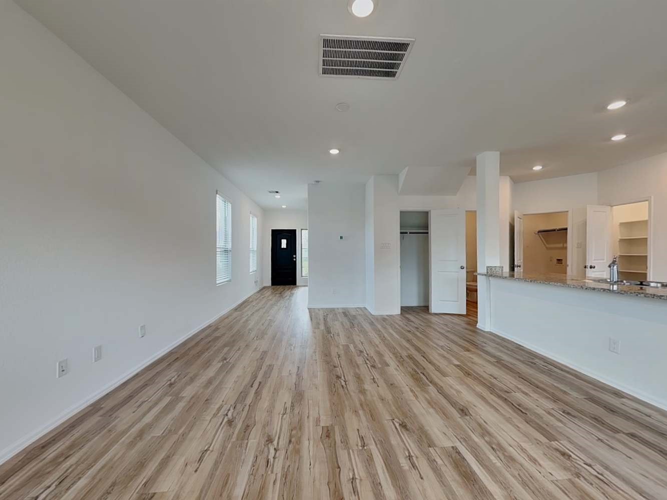 18743 Jasper Rdg Drive Hockley, TX 77447 - Photo 4 of 15 a view of an empty room with wooden floor and a window