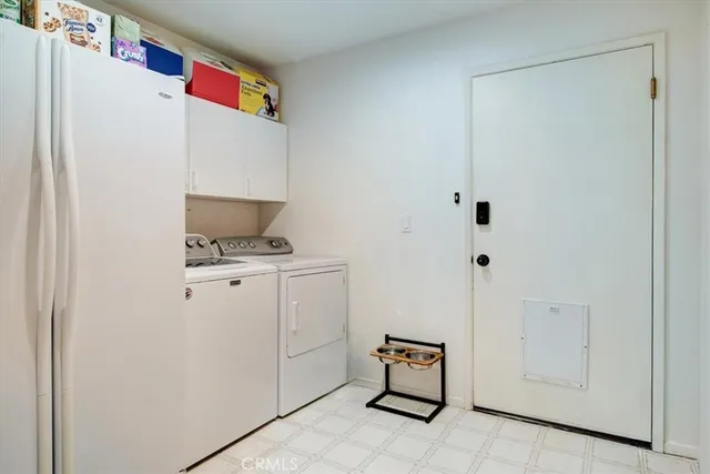 a spacious bedroom with a bed and a large window