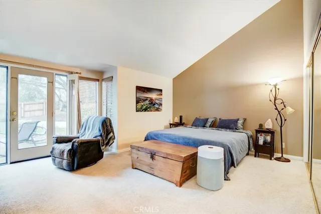 a view of a livingroom with furniture and a flat screen tv