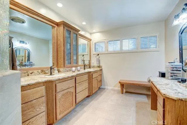 a bathroom with a double vanity sink mirror and double