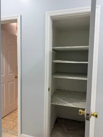 a storage room with washer and dryer