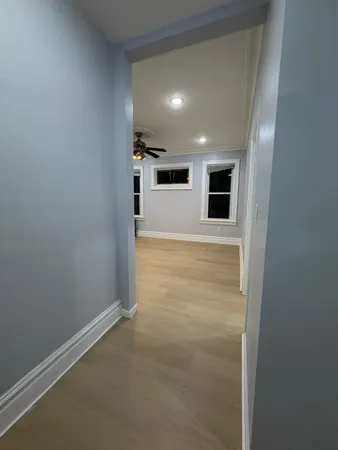 a view of hallway with kitchen