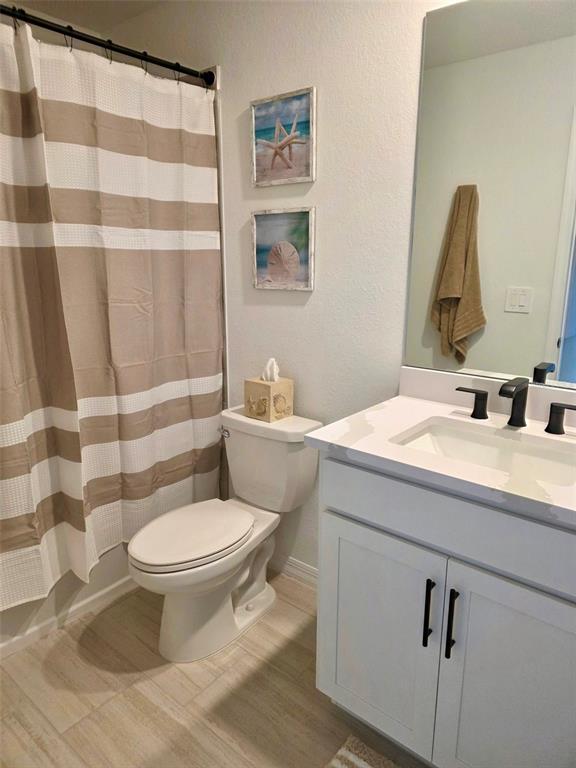 19116 Scallop Loop, Unit 303 Lakewood Ranch, FL 34211 - Photo 7 of 32 a bathroom with a sink toilet and shower