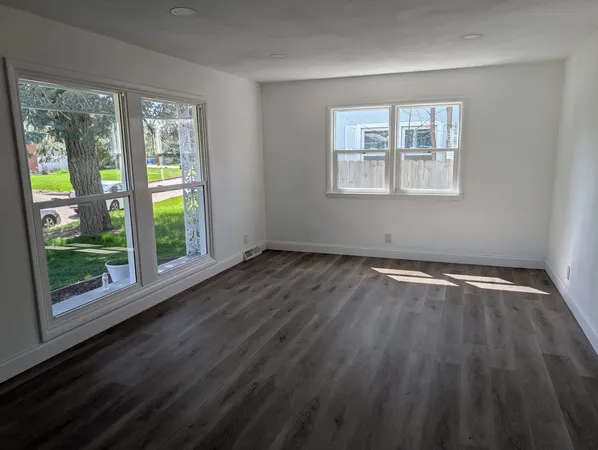 a kitchen with granite countertop stainless steel appliances a stove a sink and a microwave