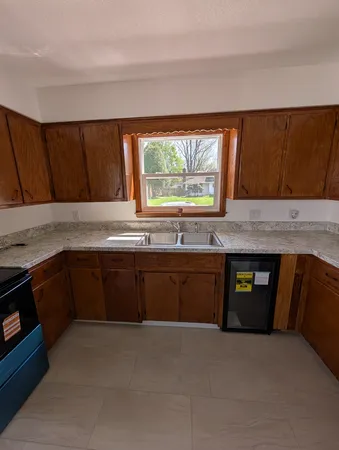 a kitchen with stainless steel appliances granite countertop a stove and a microwave