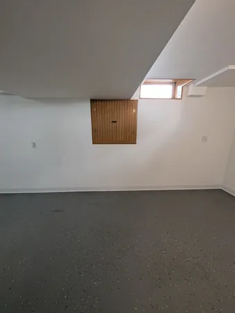 a view of empty room with stairs