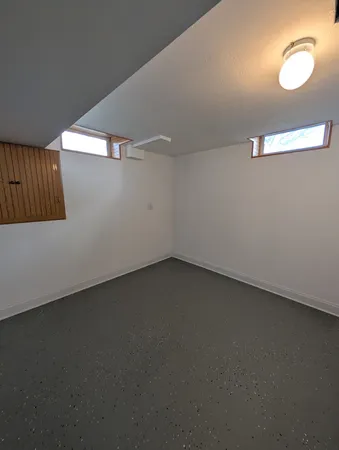 a room with a washing machine and sink