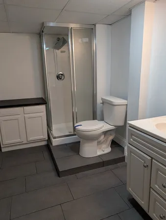 a bathroom with a shower and a tub