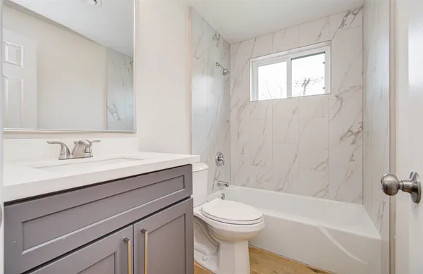 a view of yard with grass and a large tree