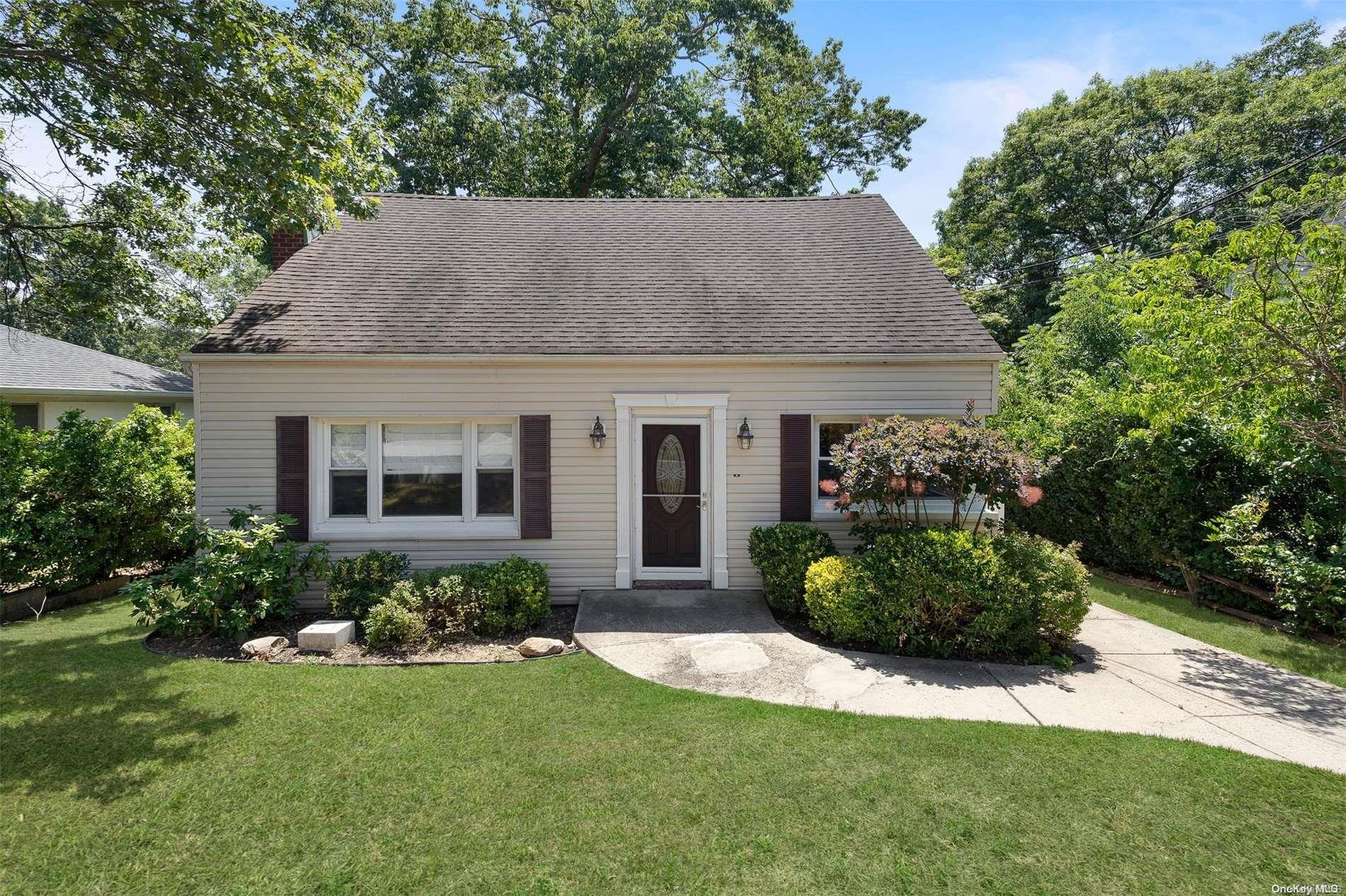 10 Ridge Road Bayville, NY 11709 - Photo 1 of 1 a view of a house with a garden and plants