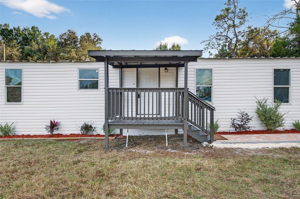 6455 West Cardinal Street Homosassa, FL 34446 - Photo 12 of 38 a view of a house with backyard and a tree