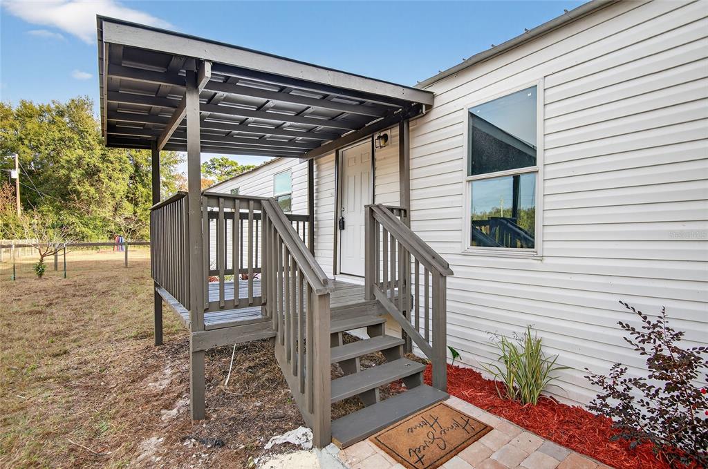 6455 West Cardinal Street Homosassa, FL 34446 - Photo 15 of 38 a view of entryway with wooden floor and fence