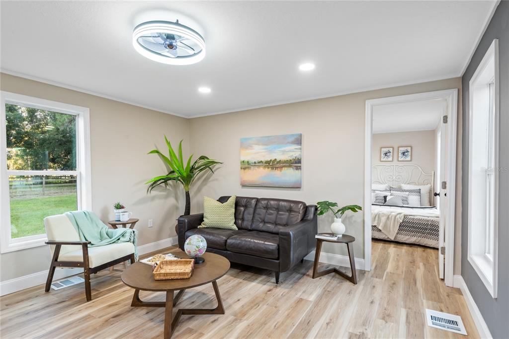 6455 West Cardinal Street Homosassa, FL 34446 - Photo 24 of 38 a living room with furniture and a potted plant
