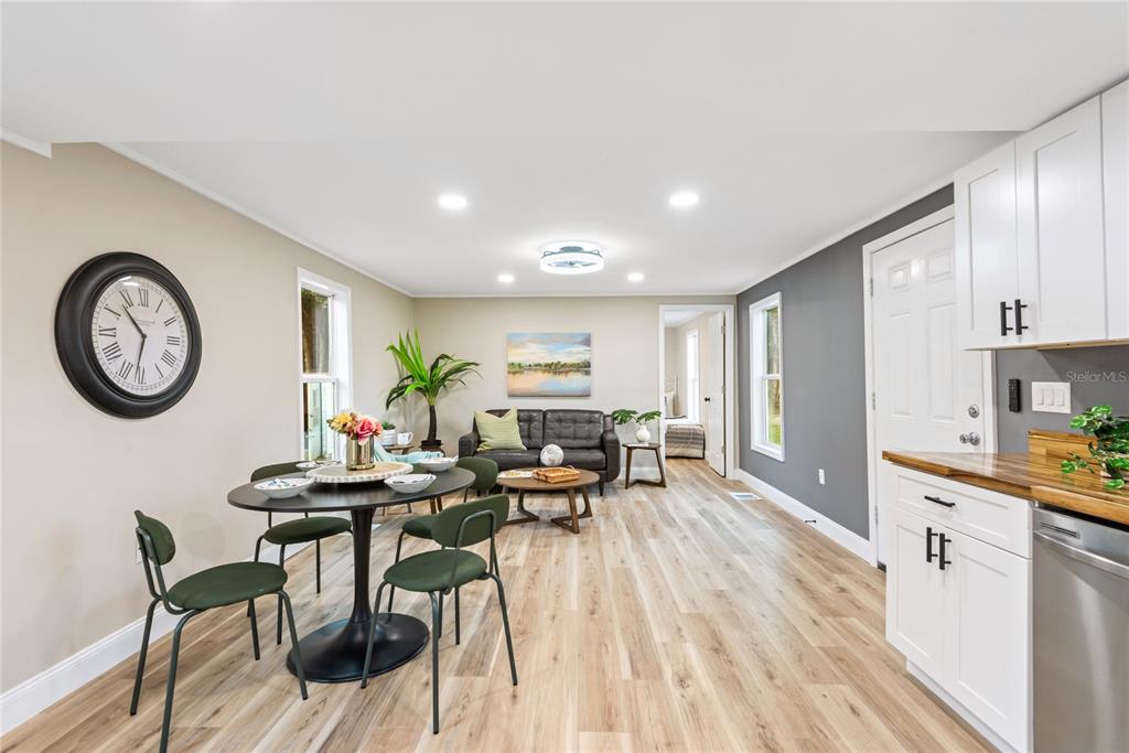 6455 West Cardinal Street Homosassa, FL 34446 - Photo 25 of 38 a view of a dining room with furniture window and wooden floor