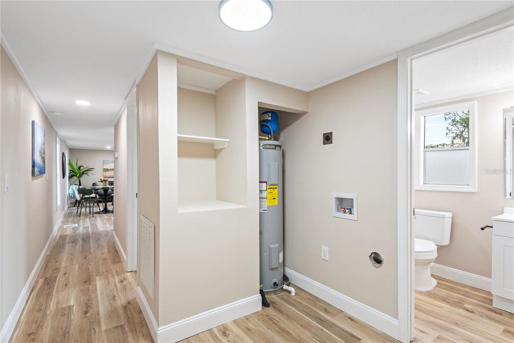 6455 West Cardinal Street Homosassa, FL 34446 - Photo 28 of 38 a view of a hallway with wooden floor and entryway