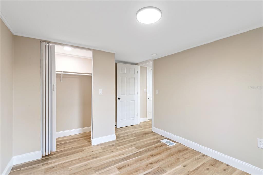6455 West Cardinal Street Homosassa, FL 34446 - Photo 30 of 38 a view of an empty room and wooden floor
