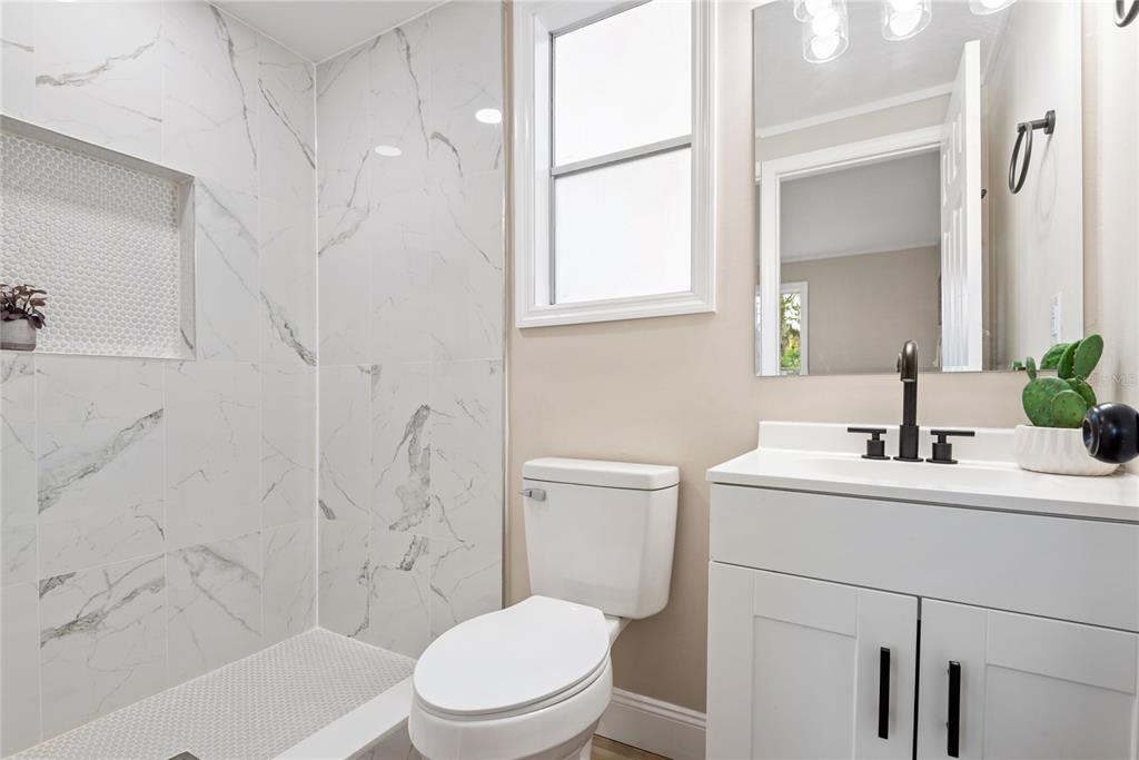 6455 West Cardinal Street Homosassa, FL 34446 - Photo 32 of 38 a bathroom with a sink a toilet and shower